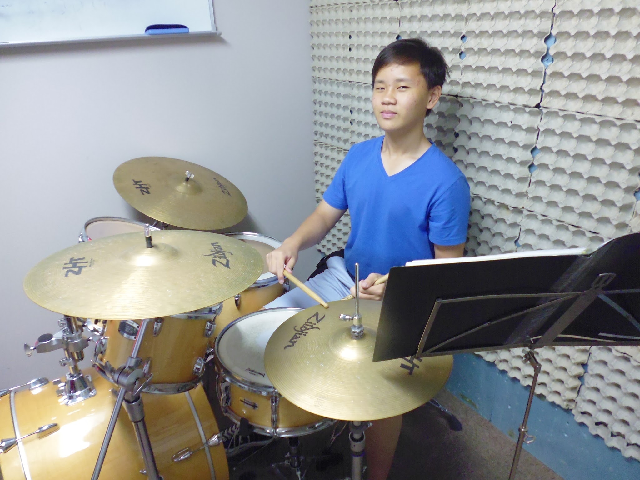 Student drummer practising in the sound-treated studio
